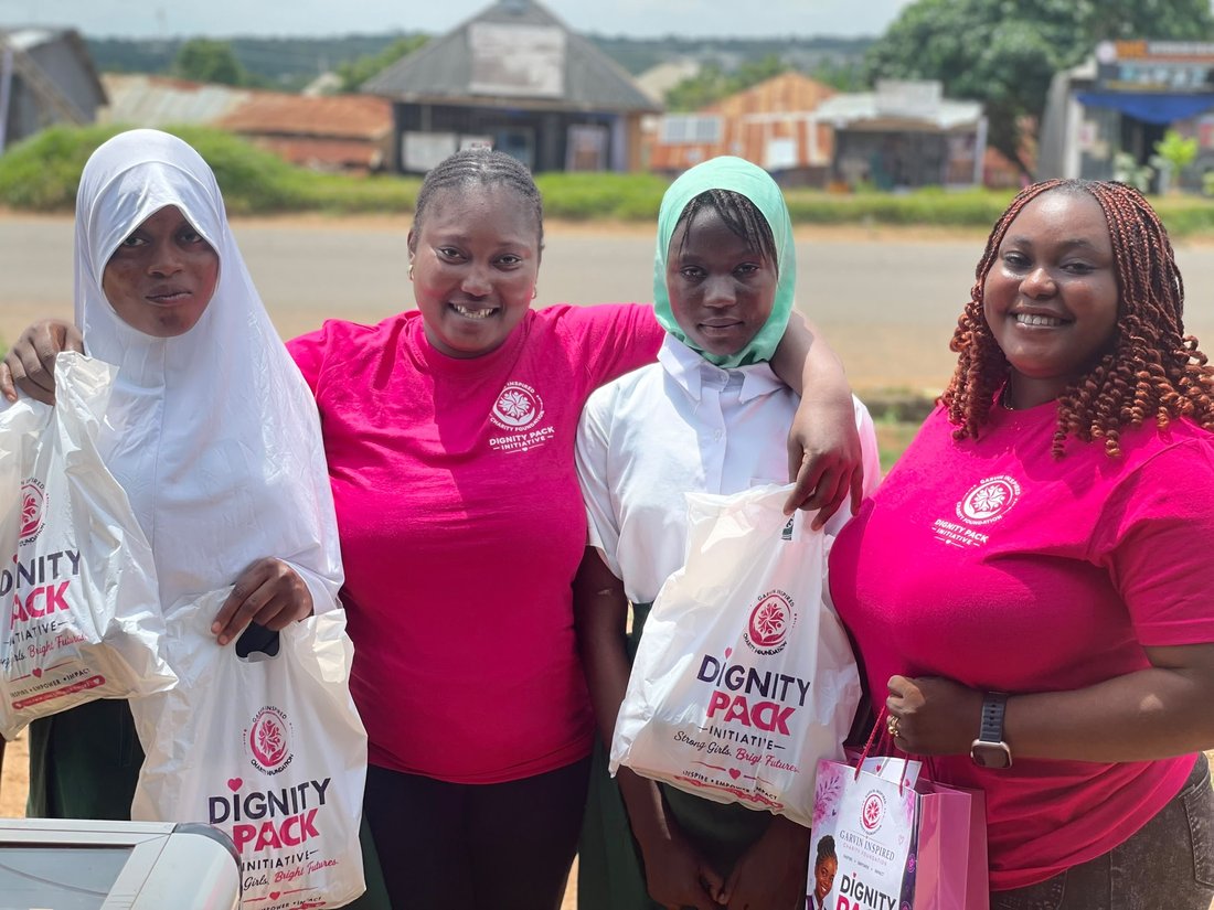 Garvin Inspired Charity Foundation volunteers distributing Dignity Pack kits to schoolgirls