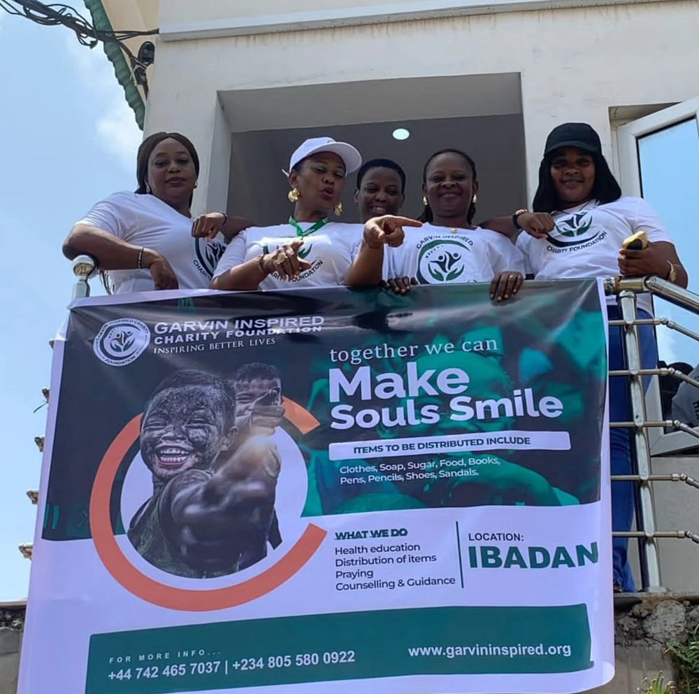 Garvin Inspired Charity Foundation volunteer team with their Make Souls Smile outreach banner in Ibadan